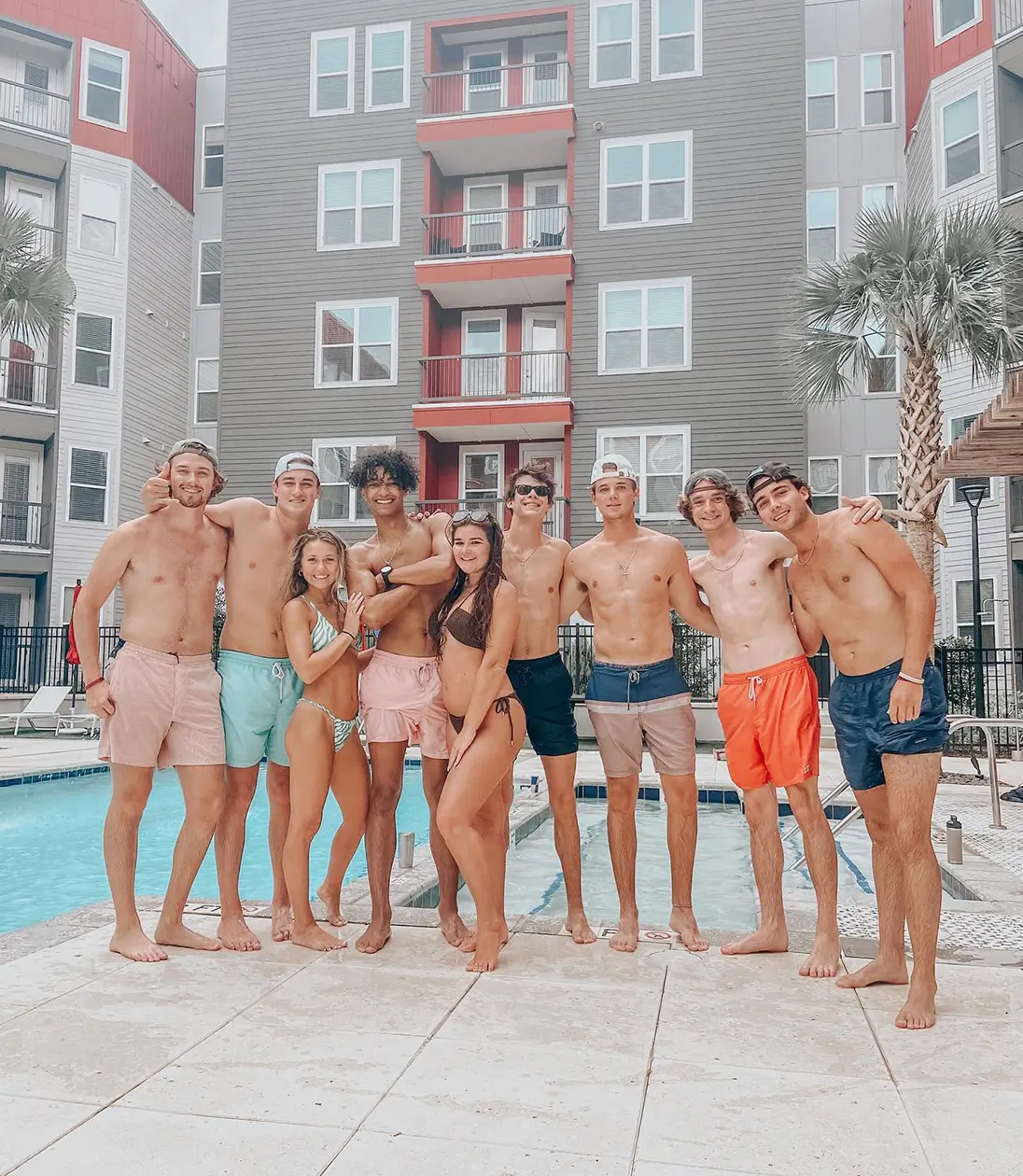 group of young adults by the pool