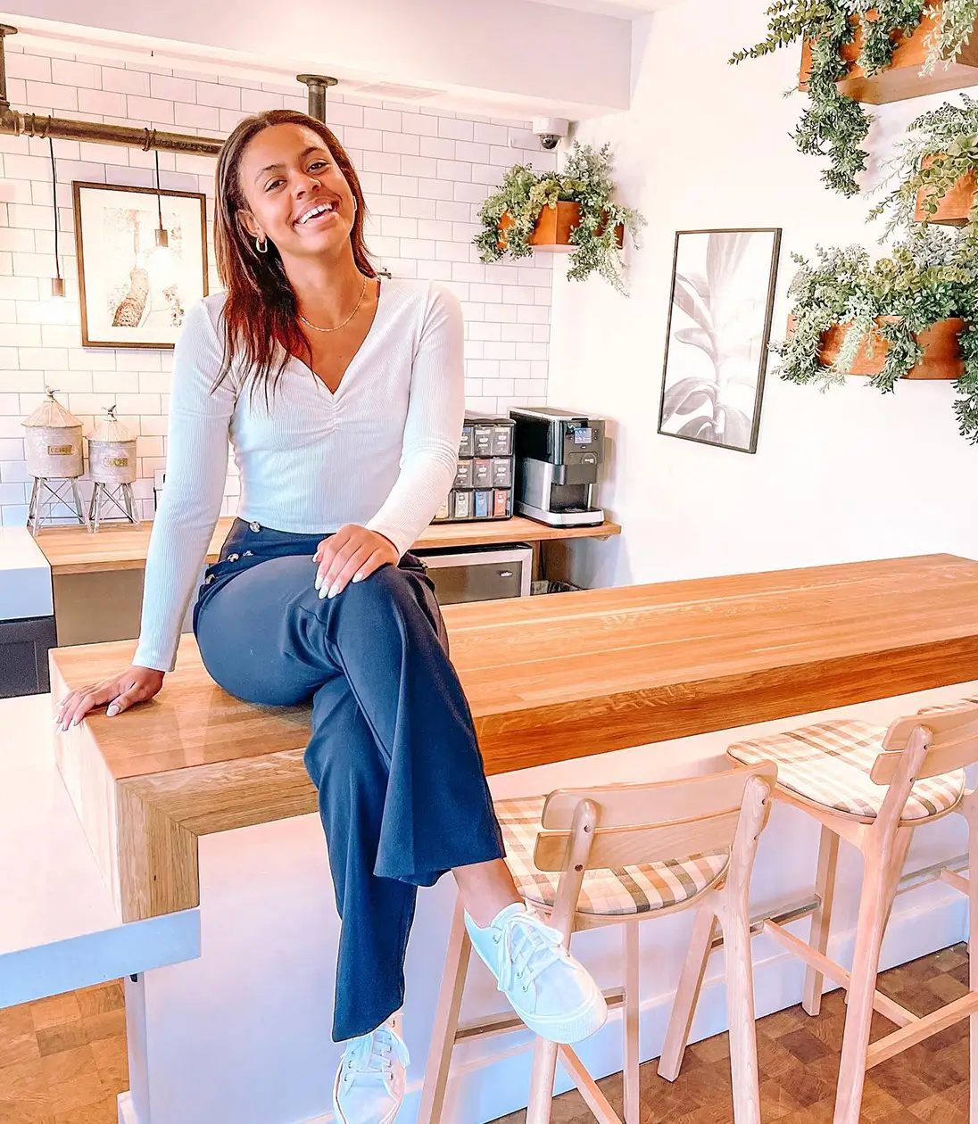 young woman sitting on a counter